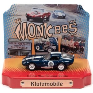 Shelby Cobra Daytona “Klutzmobile” Blue Metallic with White Stripes “The Monkees” with Collectible Tin Display “Silver Screen Machines” Series 1/64 Diecast Model Car by Johnny Lightning