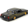 1986 Chevrolet Monte Carlo SS Lowrider Black Metallic with Gold Graphics and Wheels “Lowriders” Series 1/24 Diecast Model Car by Maisto