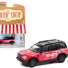 2021 Ford Bronco Sport Pink and Black “Off-Roadeo Adventure Support Truck” with Backpacker Figurine “The Hobby Shop” Series 11 1/64 Diecast Model Car by Greenlight